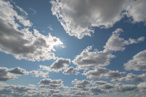 daytime sky with many small white clouds