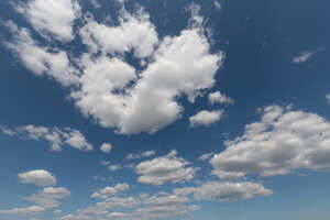 daytime sky with medium white clouds