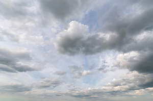 pale blue sky with greyish clouds