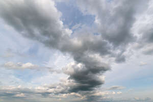 daytime sky with zigzag shaped cloud