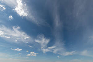 deep blue sky with tiny white clouds