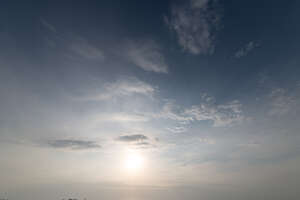 afternoon sky with sun low in the sky