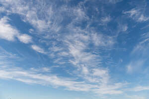 daytime sky with thin clouds floating around