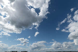 blue sky with large white clouds