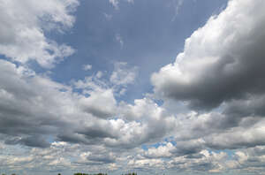 pale blue sky with slightly greyish clouds