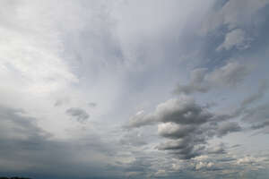 sky covered with thin layer of clouds