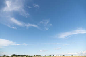 clear daytime sky with few thin clouds