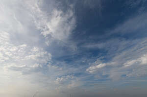 deep blue sky with thin clouds