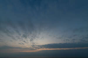 late evening sky with sun behind the horizon