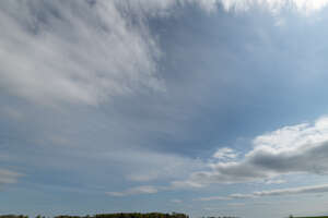 daytime sky with cirrus and cumulus clouds
