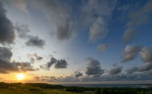 sunset with sun visible above the horizon