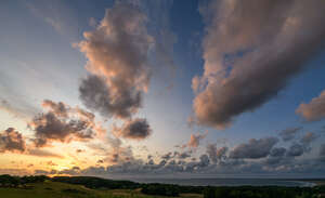 sunset with pink and golden clouds