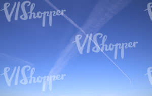 clear blue sky with contrails
