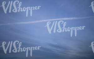 evening sky with puprle clouds and contrails