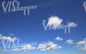 blue daytime sky with cumulus clouds