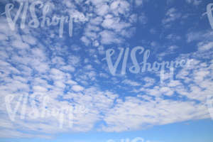 daytime sky with scattered thin clouds