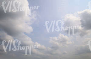 light blue sky with cumulus clouds