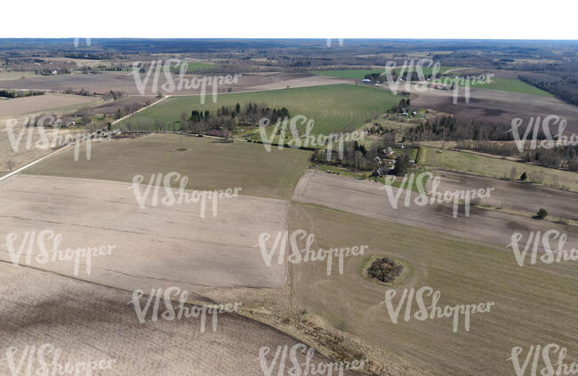 countryside with bare fields in early spring shot from high above