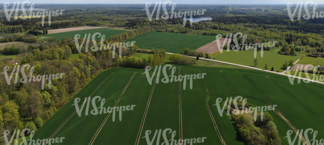 countryside with forests lake and fields seen from above