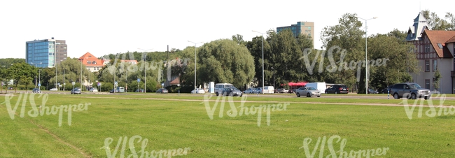 lawn with a street and houses in the background