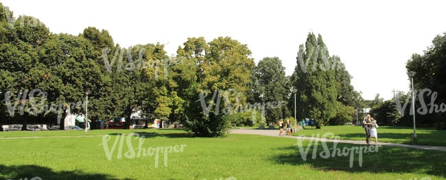 park with people walking on the sidewalk