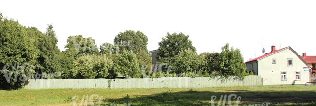 suburbian landscape with a house and a fence