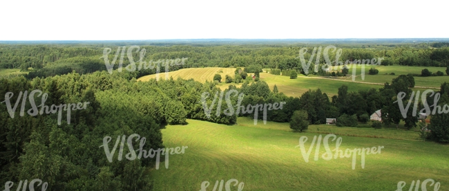 aerial view of a landscape of meadows and trees