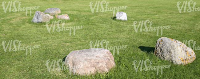green lawn with a few big rocks