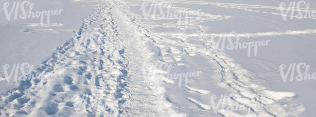 field of snow with a footpath