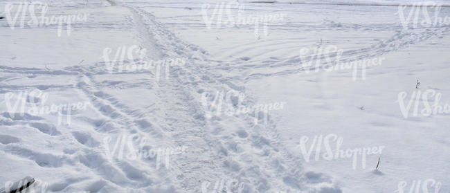 snowy field with a small footpath