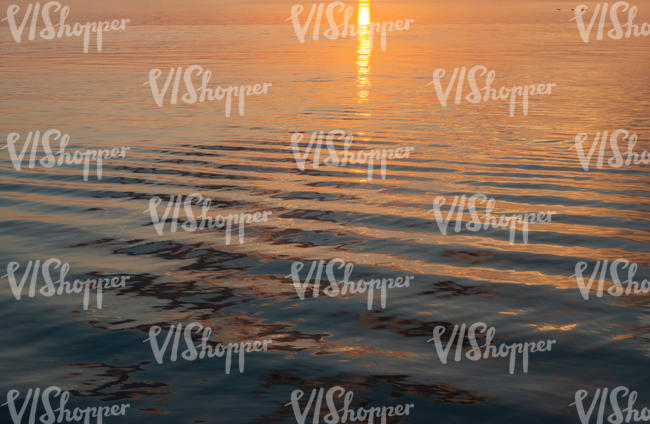 sea with sunset reflection