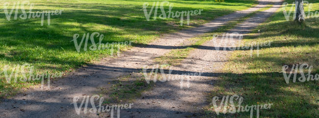 small gravel road with shadows