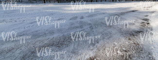 snowy road with shadows