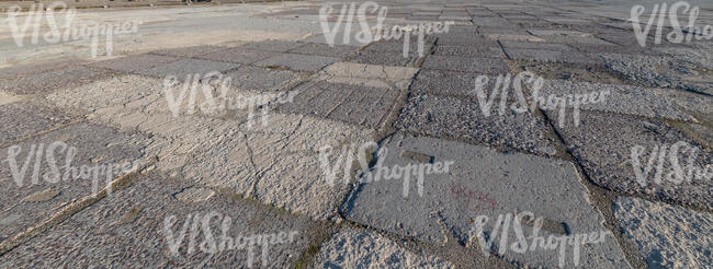 field of old tarmac in evening light