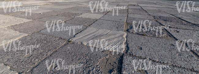 asphalt plates in evening sun