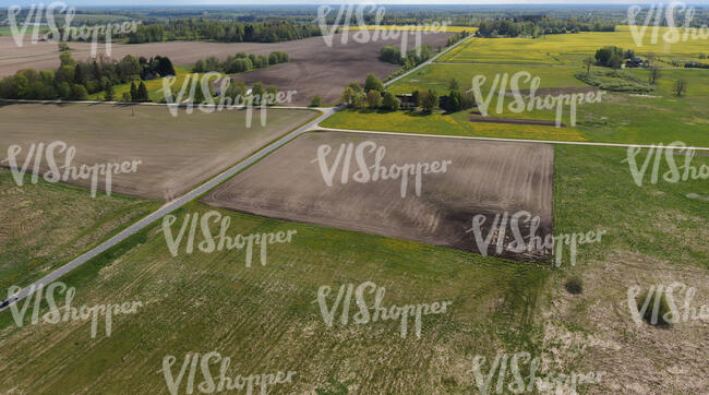 countryside with fields and grass seen from above