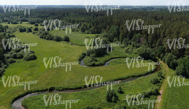 aerial view of a countryside with river and forests