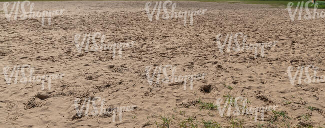 sand with footrints in sunlight