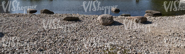 rocky bank of a pond