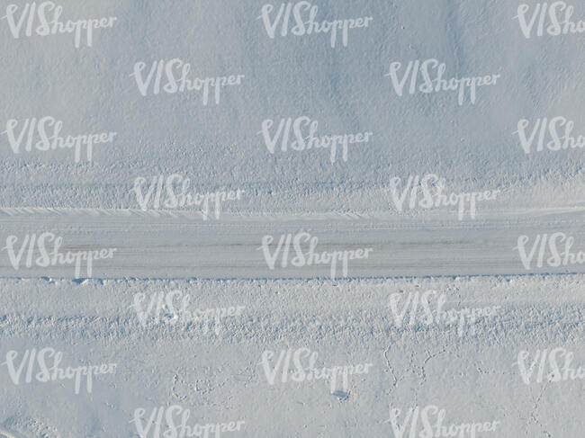 aerial view of a snow covered road