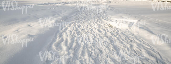 footpath in winter with many footprints