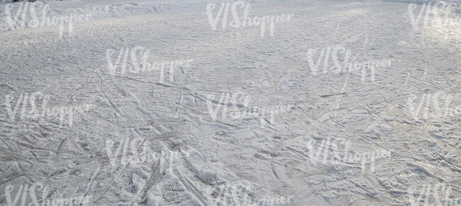 frozen lake surface with skating tracks