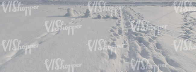 field of snow with footprints