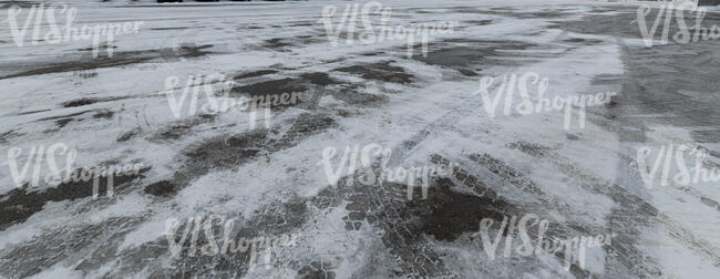 asphalt field covered with snow and ice