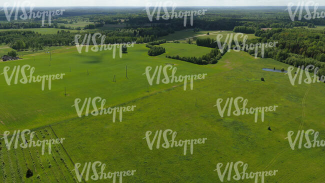 aerial view of a countryside with green fields