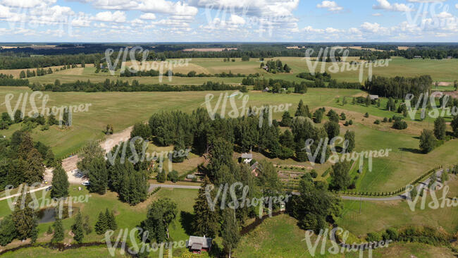 aerial view of a countryside with houses and roads