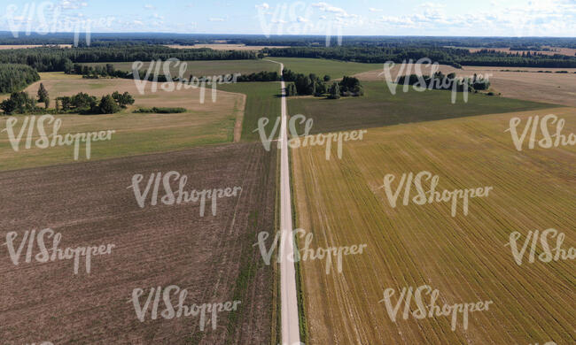 aerial view of a road between fields in late summer