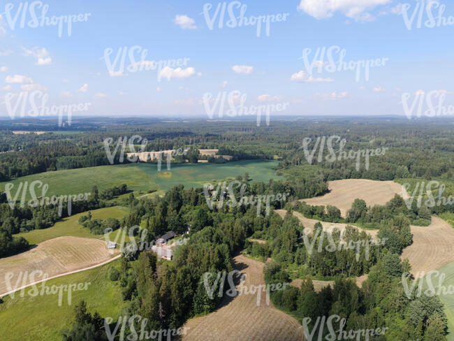 aerial view of agricultural fields and some forests