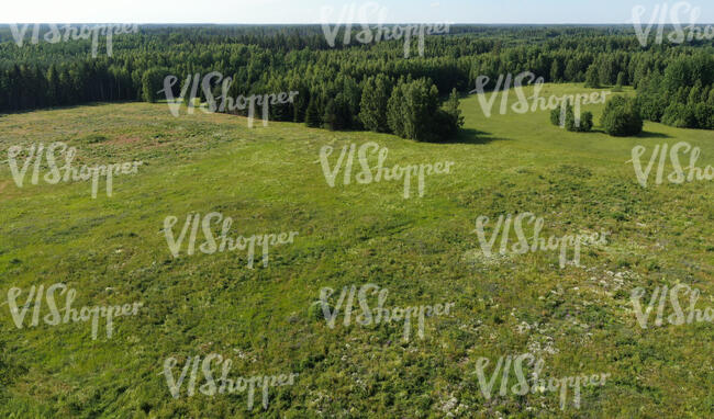 aerial view of a rural landscape with a large grassland