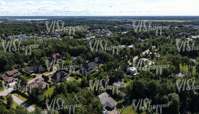 aerial view of a suburb with houses and trees
